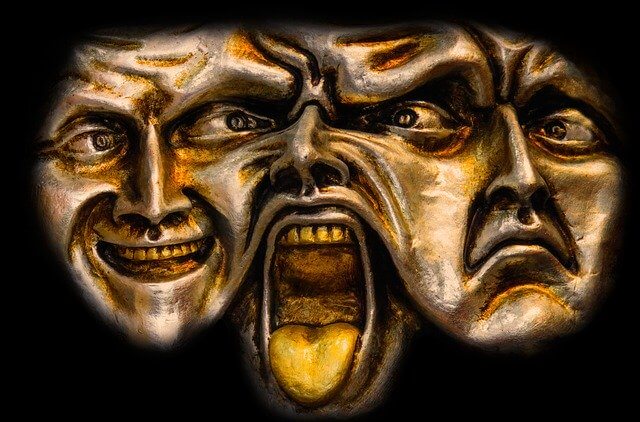 3 faces sculptures with different facial expressions